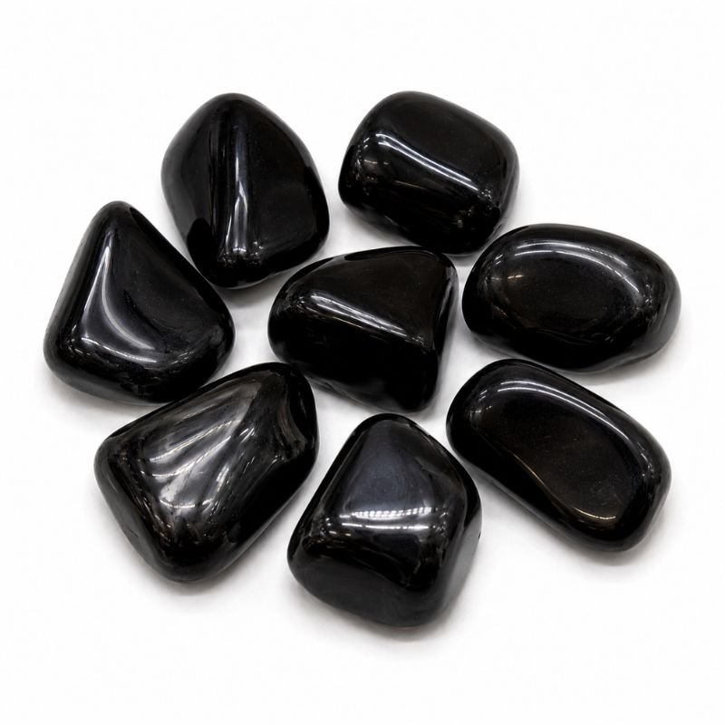 Natural polished Obsidian Tumble Stone with deep black color and smooth glossy finish on a white background