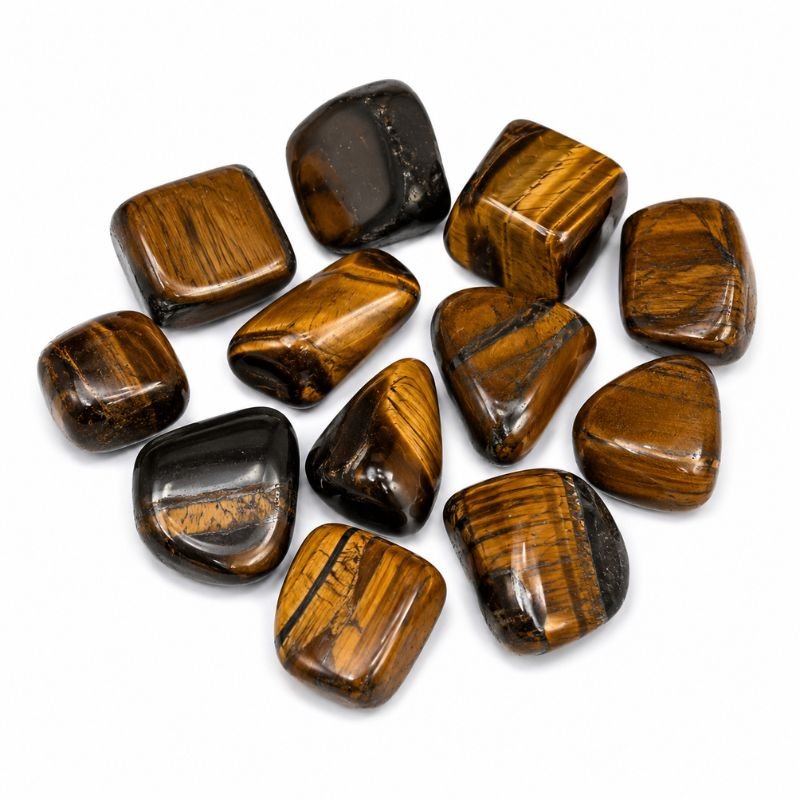 Natural polished Tiger Eye Tumble Stone with golden brown bands and silky shine on a white background
