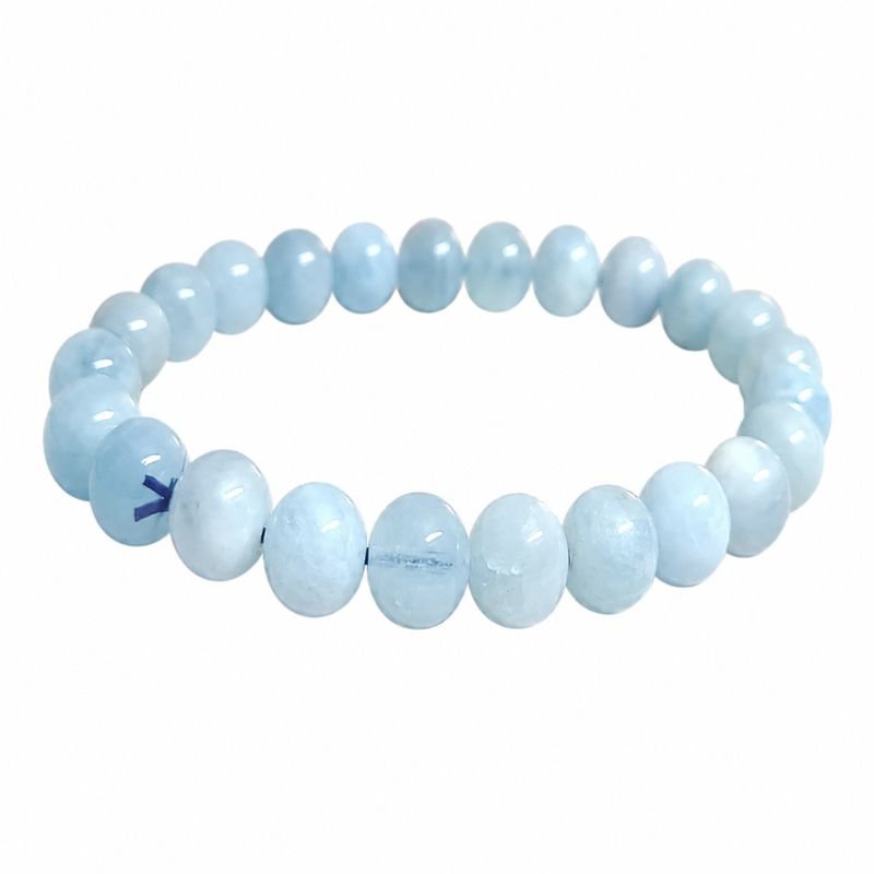 Natural Blue Aquamarine Round Bead Bracelet featuring polished aquamarine gemstone beads for calmness, clear communication, courage, emotional balance, and inner peace.