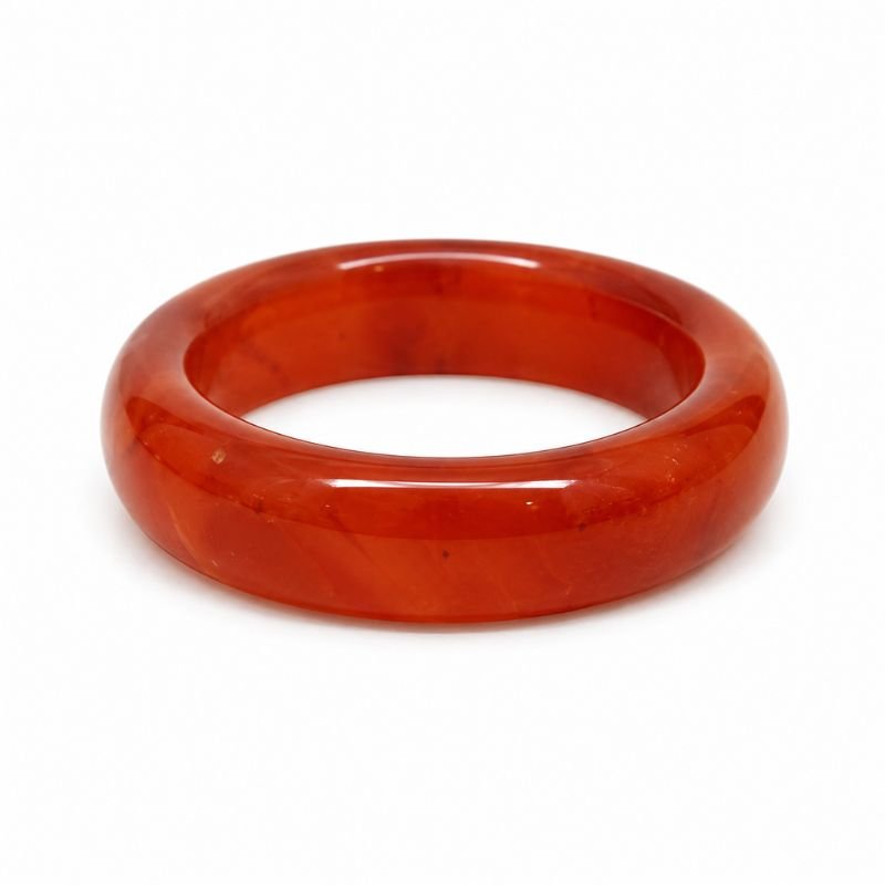 Natural Carnelian Band Ring with polished orange-red gemstone in a smooth crystal band design