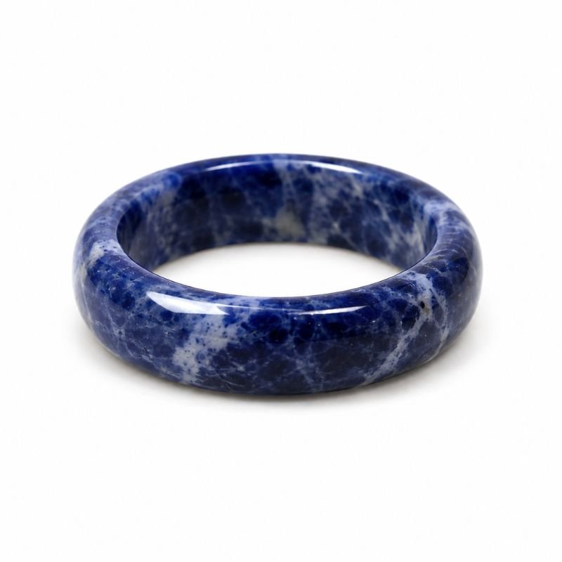 Natural Sodalite Band Ring with deep blue gemstone and white veining polished in a smooth crystal band design